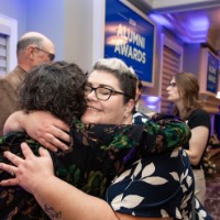 Suzanne Zack hugs a friends